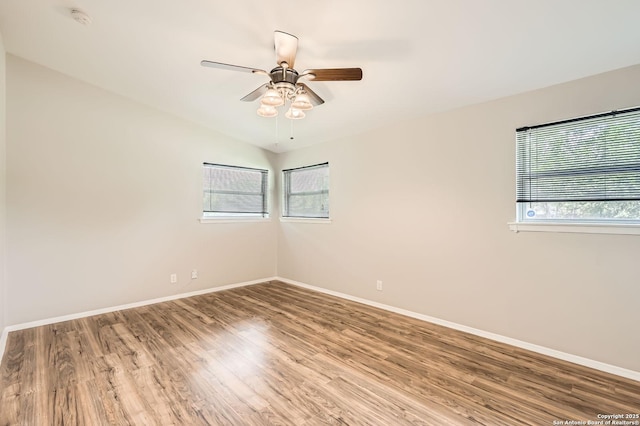 142 Winn, Universal City, TX 78148 - unfurnished room with plenty of natural light, a smoke detector, wood finished floors, and a ceiling fan