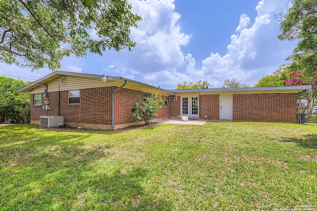 142 Winn, Universal City, TX 78148 - back of property featuring brick siding, french doors, a yard, and a patio area