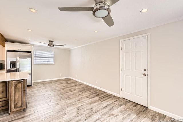 142 Winn, Universal City, TX 78148 - unfurnished living room featuring ceiling fan, crown molding, light wood-style floors, and recessed lighting