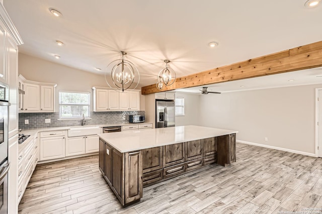 142 Winn, Universal City, TX 78148 - kitchen featuring stainless steel appliances, a chandelier, light countertops, white cabinetry, and recessed lighting