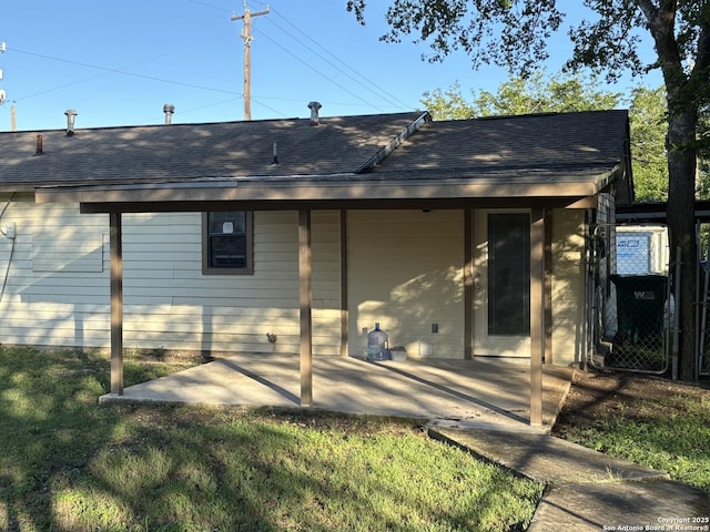 401 W Lindbergh Blvd, Universal City, TX 78148 - back of property with a patio and a shingled roof