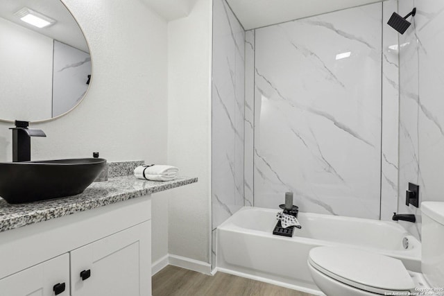 333 S Mesquite, New Braunfels, TX 78130 - bathroom with vanity, wood finished floors, and washtub / shower combination