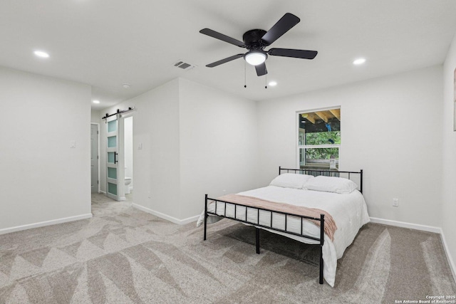 333 S Mesquite, New Braunfels, TX 78130 - bedroom with a barn door, recessed lighting, carpet, and a ceiling fan