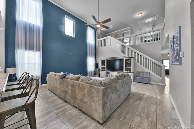 141 Whitetail Pass, San Antonio, TX 78253 - living room with a towering ceiling, stairs, and a ceiling fan