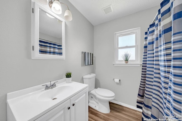 808 Fern Mdw, Universal City, TX 78148 - bathroom with wood finished floors and vanity