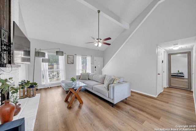 808 Fern Mdw, Universal City, TX 78148 - living area featuring light wood-type flooring, ceiling fan, high vaulted ceiling, and beam ceiling