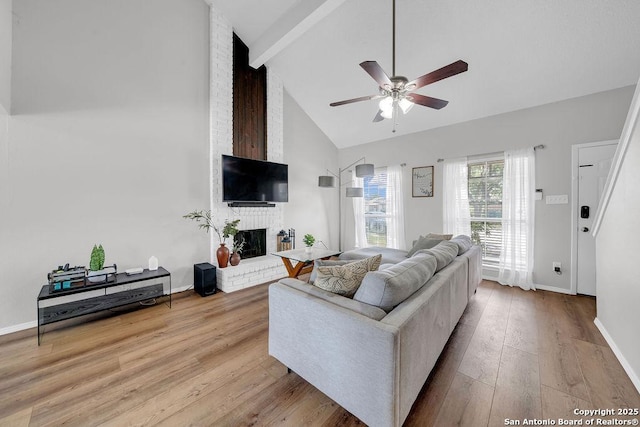 808 Fern Mdw, Universal City, TX 78148 - living area featuring ceiling fan, high vaulted ceiling, beam ceiling, a brick fireplace, and wood finished floors