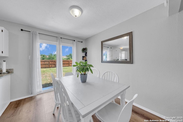 808 Fern Mdw, Universal City, TX 78148 - dining area with wood finished floors and a textured ceiling