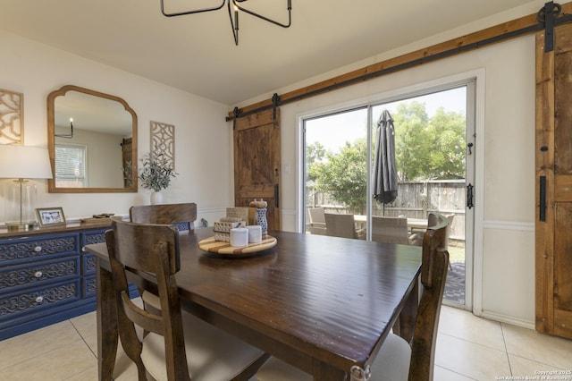 11862 Barkston, San Antonio, TX 78253 - dining area featuring a barn door and light tile patterned floors