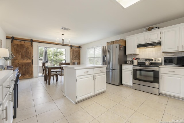 11862 Barkston, San Antonio, TX 78253 - kitchen featuring stainless steel appliances, a barn door, under cabinet range hood, backsplash, and white cabinets