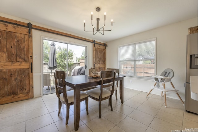 11862 Barkston, San Antonio, TX 78253 - dining space with a barn door, light tile patterned floors, and a chandelier