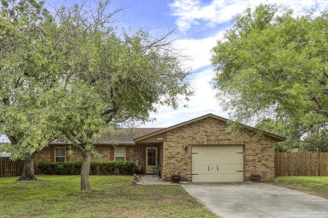 1245 Whitney, Pleasanton, TX 78064 - ranch-style house with brick siding, a garage, and driveway