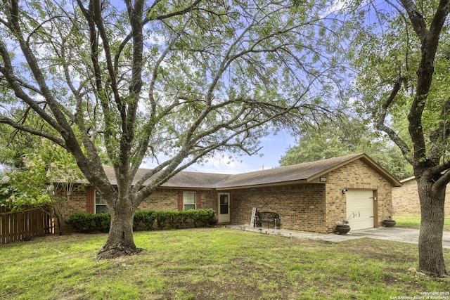 1245 Whitney, Pleasanton, TX 78064 - single story home with brick siding, driveway, a garage, and a shingled roof