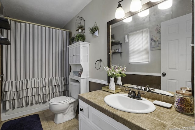 1245 Whitney, Pleasanton, TX 78064 - full bath with vanity, tile patterned flooring, and shower / bathtub combination with curtain