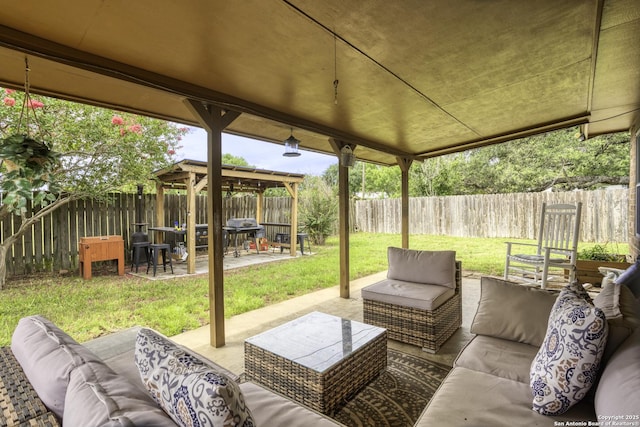 1245 Whitney, Pleasanton, TX 78064 - fenced backyard featuring an outdoor living space, a patio, grilling area, and a gazebo