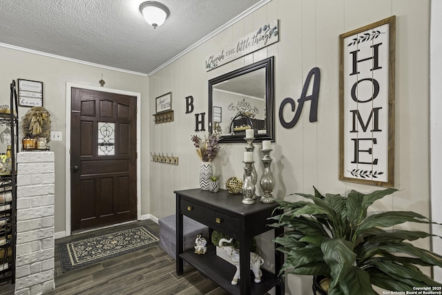 1245 Whitney, Pleasanton, TX 78064 - entryway with ornamental molding, dark wood finished floors, and a textured ceiling