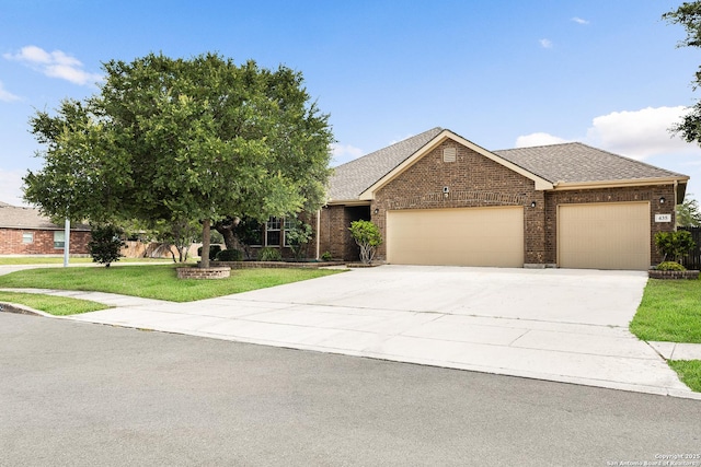 435 Red Quill Nest, San Antonio, TX 78253 - view of front of home featuring an attached garage, brick siding, a front lawn, driveway, and roof with shingles