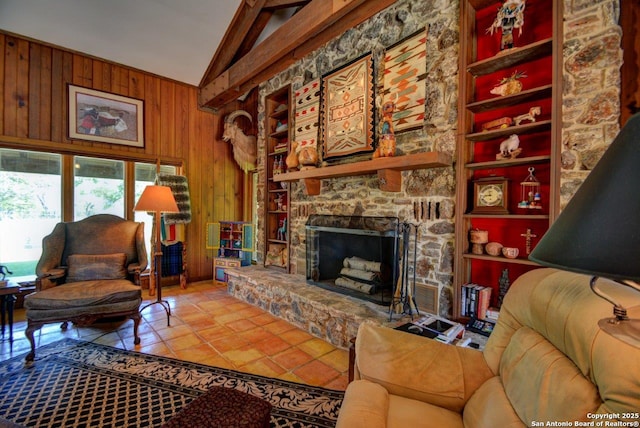 142 Four Bears Trl, Kerrville, TX 78028 - tiled living room featuring vaulted ceiling, wood walls, and a stone fireplace