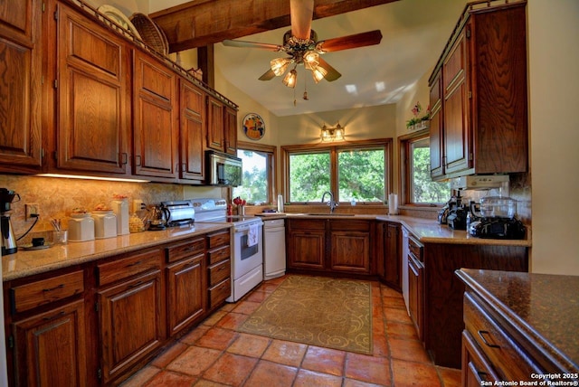 142 Four Bears Trl, Kerrville, TX 78028 - kitchen with white appliances, decorative backsplash, a ceiling fan, brown cabinetry, and stone countertops