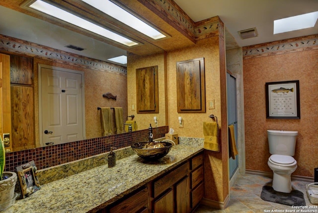 142 Four Bears Trl, Kerrville, TX 78028 - bathroom with vanity, a stall shower, and decorative backsplash