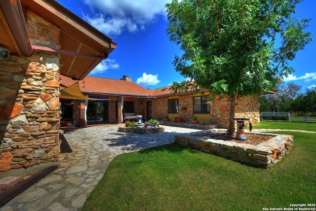142 Four Bears Trl, Kerrville, TX 78028 - view of green lawn featuring a patio