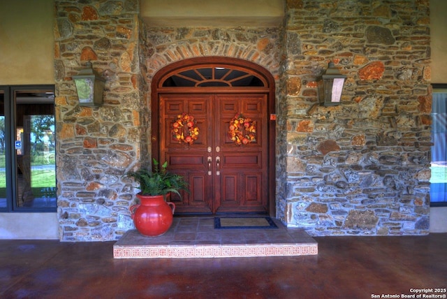 142 Four Bears Trl, Kerrville, TX 78028 - property entrance with stone siding and stucco siding