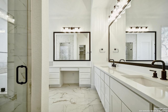409 Dulce Vis, Boerne, TX 78006 - bathroom featuring marble finish floors, double vanity, and a marble finish shower
