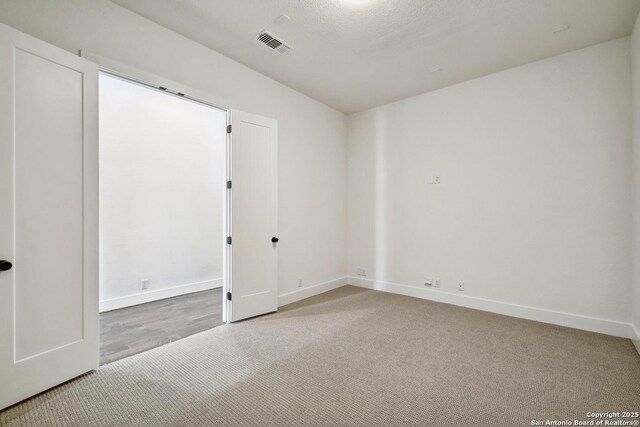 409 Dulce Vis, Boerne, TX 78006 - unfurnished bedroom featuring carpet floors and baseboards