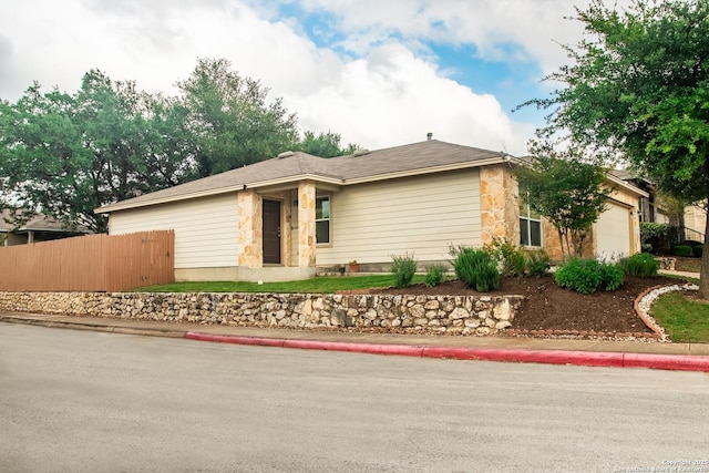 12339 Craddick Cv, San Antonio, TX 78254 - view of front of property with a garage and stone siding