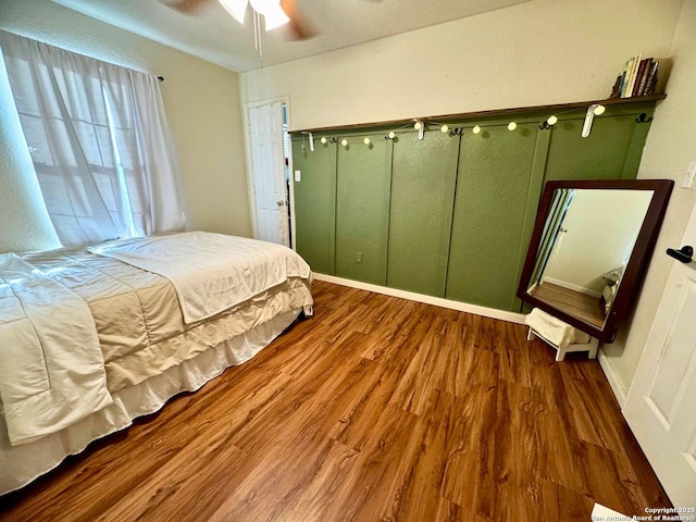 5742 Butch Cyn, San Antonio, TX 78252 - bedroom featuring wood finished floors and a ceiling fan