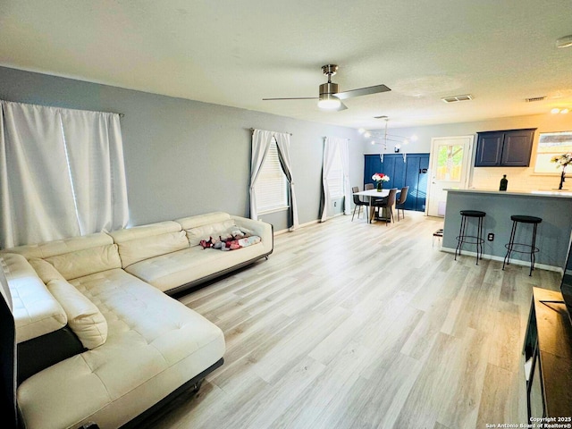 5742 Butch Cyn, San Antonio, TX 78252 - living area with a ceiling fan and light wood-type flooring