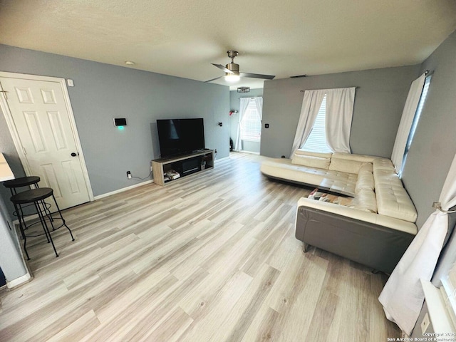 5742 Butch Cyn, San Antonio, TX 78252 - living area with a ceiling fan and light wood-type flooring