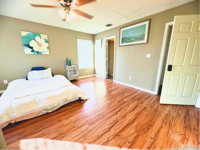 5742 Butch Cyn, San Antonio, TX 78252 - bedroom featuring wood finished floors and ceiling fan