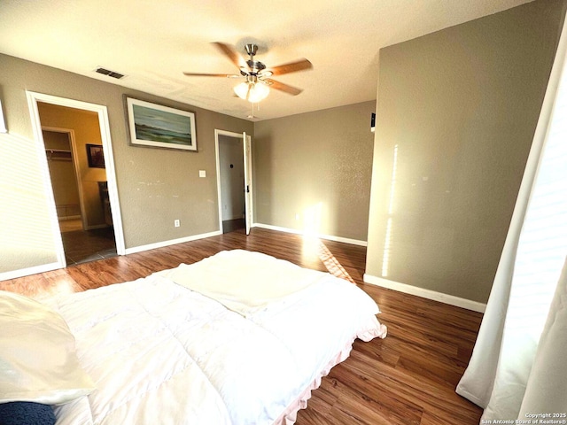 5742 Butch Cyn, San Antonio, TX 78252 - bedroom with wood finished floors and a ceiling fan