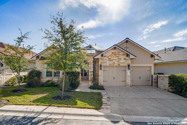 12 Denbury Gln, San Antonio, TX 78257 - view of front facade with stone siding, concrete driveway, an attached garage, stucco siding, and a front lawn