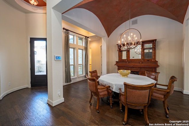 12 Denbury Gln, San Antonio, TX 78257 - dining area with a chandelier, vaulted ceiling, and dark wood-type flooring