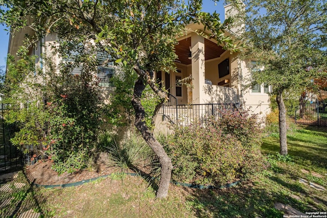 12 Denbury Gln, San Antonio, TX 78257 - view of home's exterior featuring stucco siding and a chimney