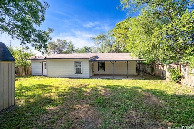 8810 Flint Vly, San Antonio, TX 78227 - back of property with a fenced backyard and a patio area