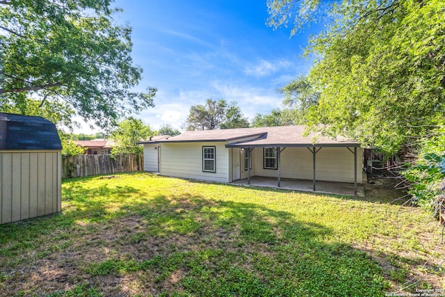 8810 Flint Vly, San Antonio, TX 78227 - back of house featuring a patio area, a storage unit, and a detached carport