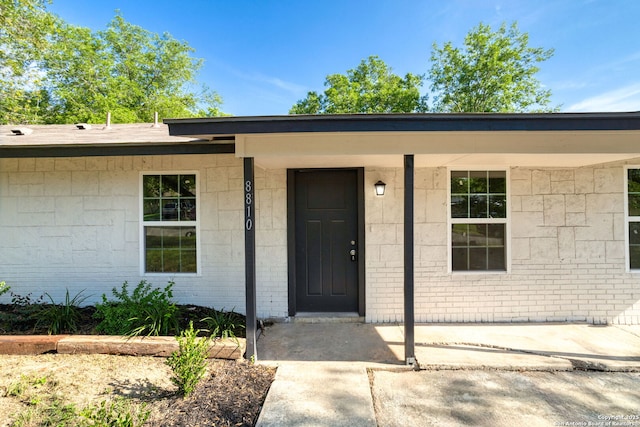 8810 Flint Vly, San Antonio, TX 78227 - view of exterior entry featuring a porch and brick siding