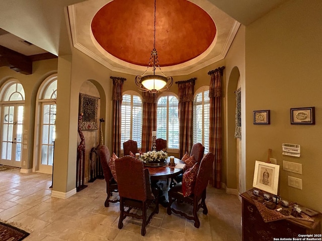107 Geddington, Shavano Park, TX 78249 - dining room featuring crown molding, a raised ceiling, arched walkways, and french doors