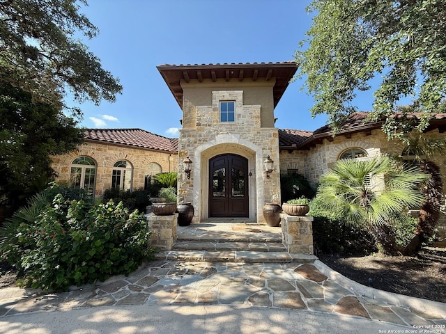 107 Geddington, Shavano Park, TX 78249 - doorway to property with a tiled roof, stone siding, and stucco siding