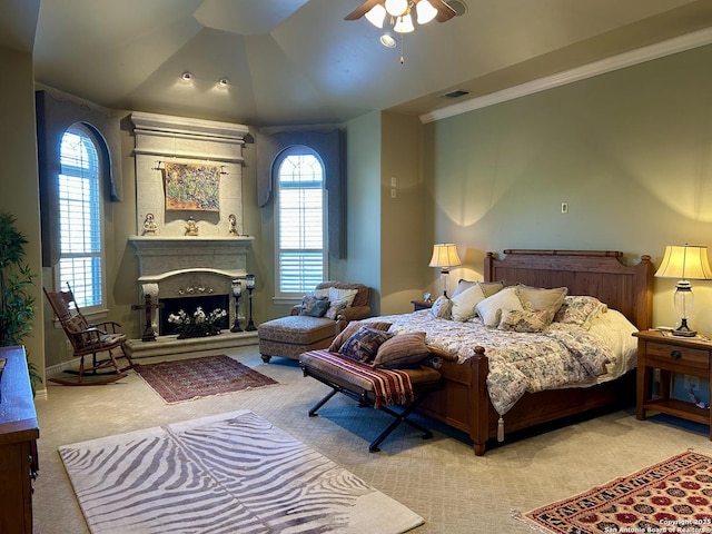 107 Geddington, Shavano Park, TX 78249 - bedroom with carpet floors, ornamental molding, a fireplace with raised hearth, and a ceiling fan