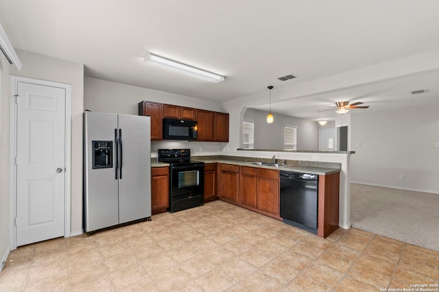 9218 Pacific Maple, San Antonio, TX 78254 - kitchen with black appliances, a peninsula, ceiling fan, decorative light fixtures, and open floor plan