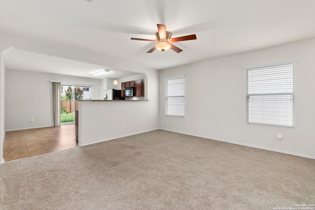 9218 Pacific Maple, San Antonio, TX 78254 - unfurnished living room with light colored carpet and ceiling fan