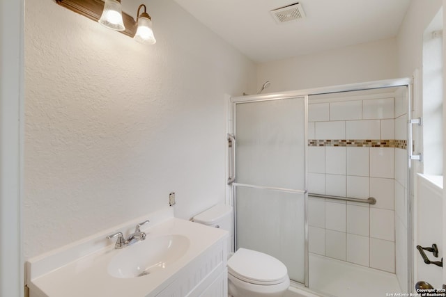 2743 Fairview, Canyon Lake, TX 78133 - bathroom with a stall shower, vanity, and a textured wall
