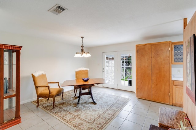 2743 Fairview, Canyon Lake, TX 78133 - foyer with light tile patterned floors and a chandelier