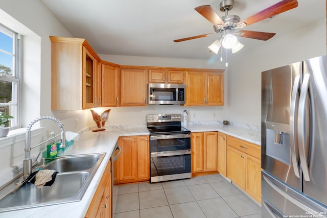 2743 Fairview, Canyon Lake, TX 78133 - kitchen featuring appliances with stainless steel finishes, light tile patterned flooring, light countertops, ceiling fan, and open shelves