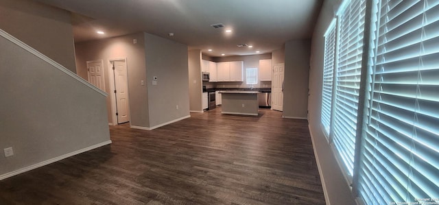 7115 Mesa Clfs, Converse, TX 78109 - unfurnished living room with dark wood-style floors and recessed lighting
