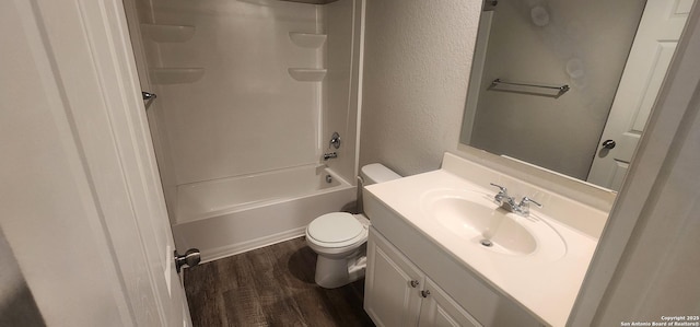7115 Mesa Clfs, Converse, TX 78109 - bathroom with vanity, wood finished floors, a textured wall, and washtub / shower combination